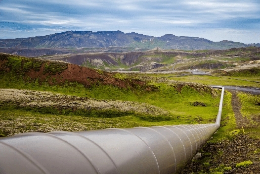 Image of a pipeline running through a mountain valley